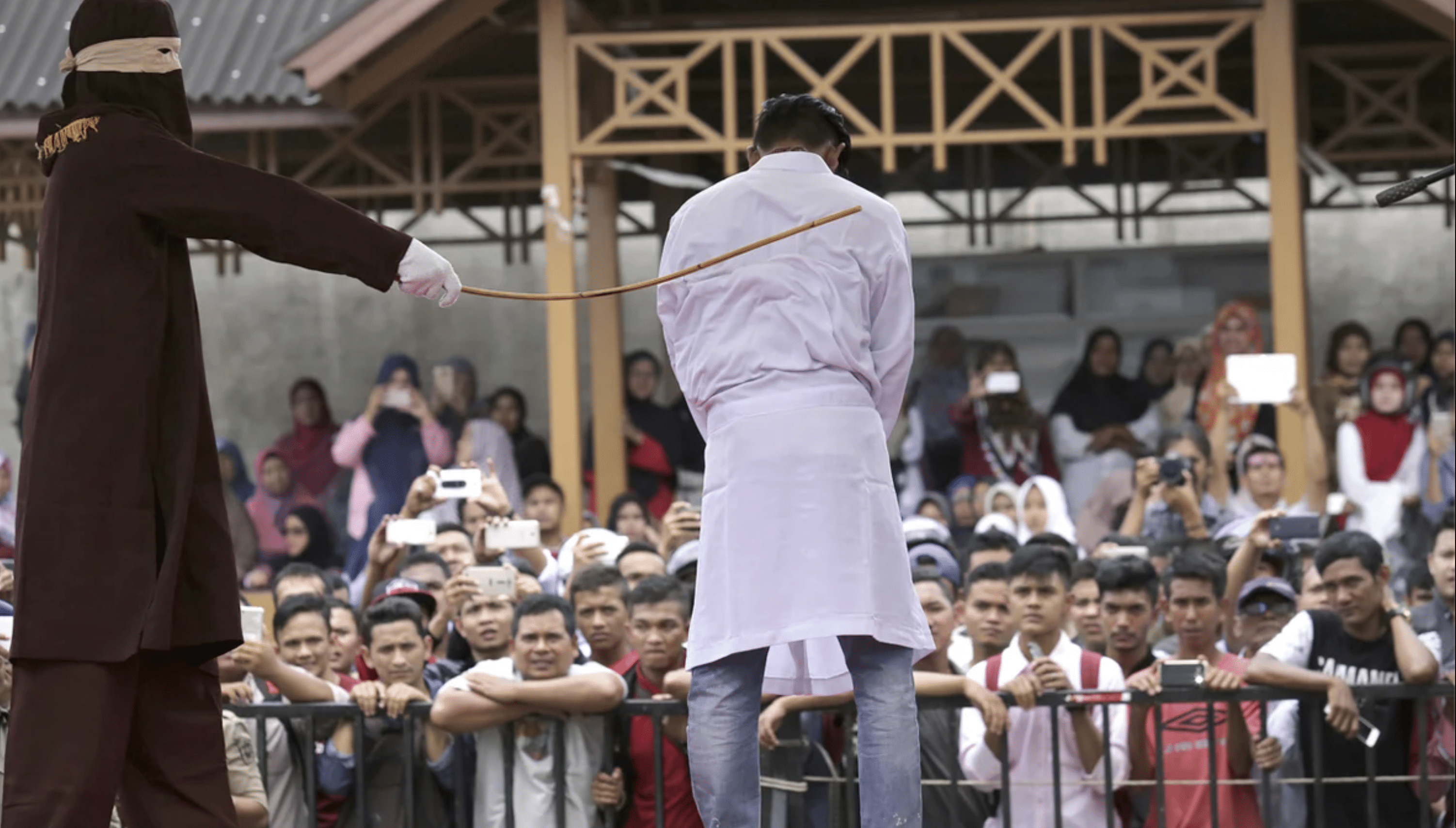 Public Caning of Two Men in Indonesia for Hugging and Kissing Sparks Global Outcry Aceh Shariah Law