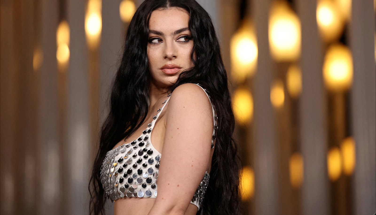 Charli XCX Shatters Expectations — and Furniture — in Surreal ‘Chains of Love’ Music Video